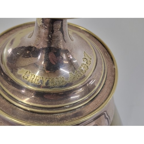 260 - A silver plate candlestick inscribed 'Greybie aged 27' on a shod horse hoof, has imperfections to th... 