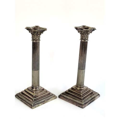 264 - Two silver plate column candlesticks, 29cm x 12cm x 12cm. 2,405gms.