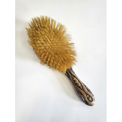 265 - A natural hairbrush with silver coloured handle