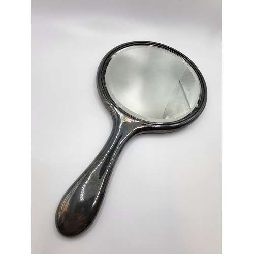 272 - A silver hand mirror James Deakin & Sons, Sheffield (date worn). 564 gms all in.