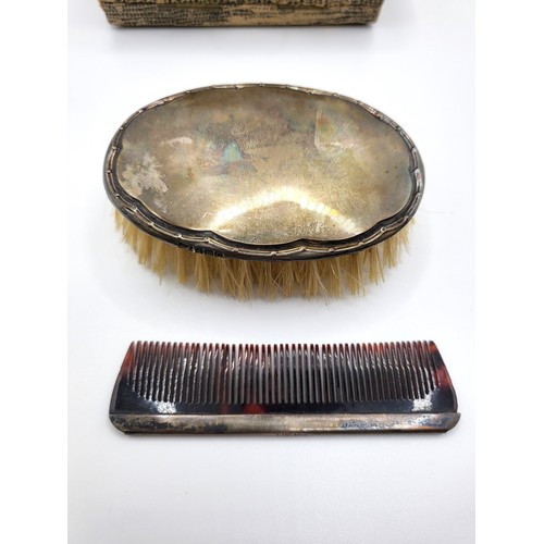 273 - A custom boxed silver brush William Adams Ltd, Birmingham 1927 and comb stamped sterling silver. (2)