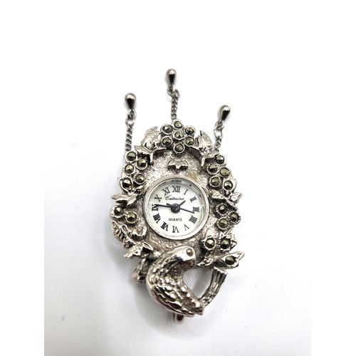 286 - Two modern ladies timepieces: one a flower basket design pendant set in marcasite (4cm closed), the ... 