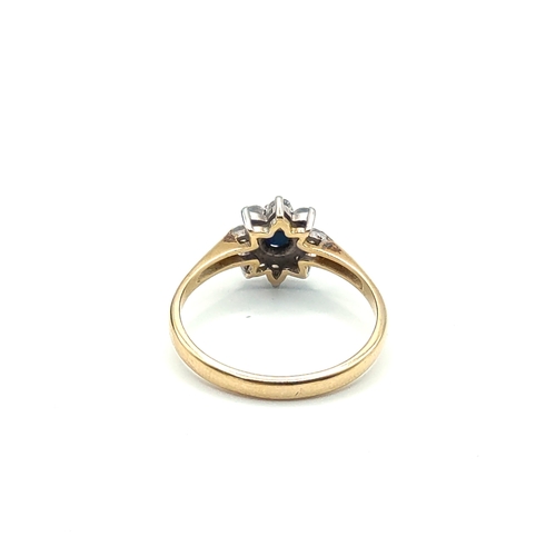 292 - A yellow metal, sapphire, and diamond floral cluster ring, set with a dark blue round-cut sapphire w... 