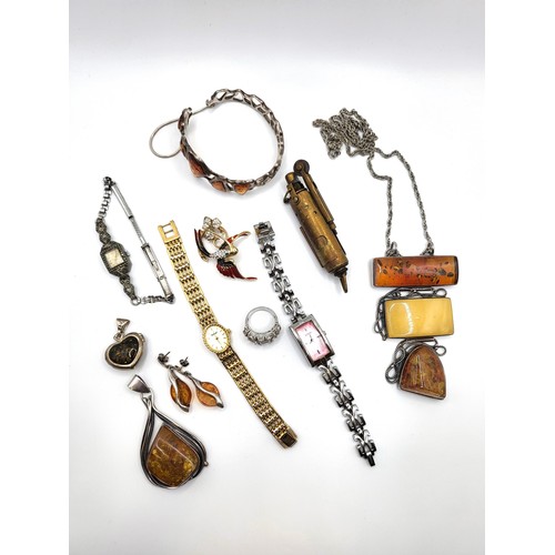 294 - A bag of jewellery including silver and amber bracelet with safety chain, a silver, amber  and honey... 