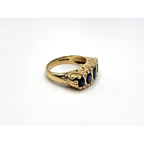 295 - An 18ct yellow gold Victorian style setting sapphire and diamond set ring. With five graduated oval ... 