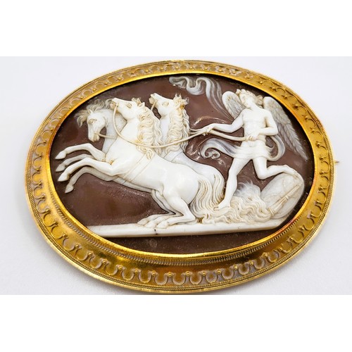 296 - Two cameo brooches: Phoebus and armour, and his horses in an ornate gold plated frame (slight damage... 