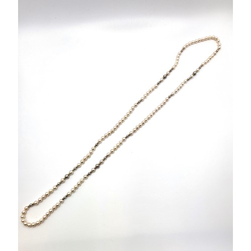 307 - A boxed cultured pearl necklace interspaced with gold spheres 76cm length and 5mm pearls. With paper... 