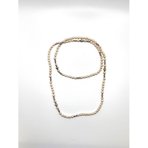 307 - A boxed cultured pearl necklace interspaced with gold spheres 76cm length and 5mm pearls. With paper... 