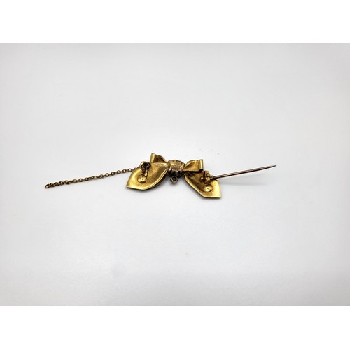 309 - A gold bow and small diamond and seed pearls brooch