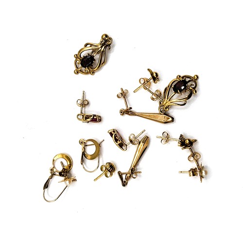 314 - Seven pairs of 9ct yellow gold earrings containing garnets, pearls, cubic zirconias, all with backs.... 