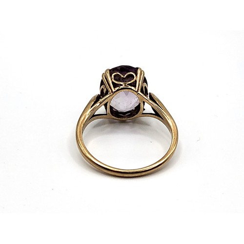 320 - A 9ct yellow gold oval amethyst set ring. 2.9gms. Size L 1/2.