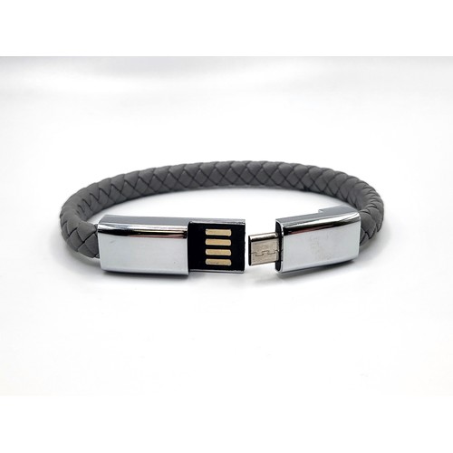 330 - Grey leather effect rope-style bracelet with stainless steel centre opening USB style clasp. 13.7gms... 