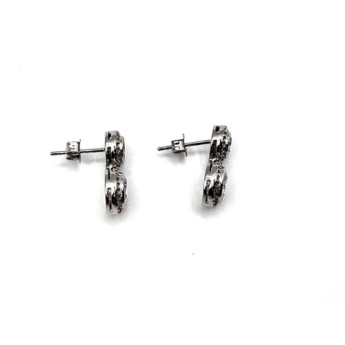 332 - A pair of silver (925) double drop cubic zirconia halo earrings.  3.8gms.