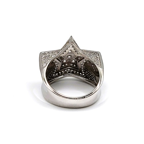 334 - A large silver cubic zirconia set dress ring in a star shape. 9.1gms. Size R 1/2.