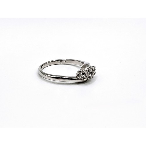 344 - An 18ct white gold diamond trilogy twist ring. Round brilliant cut diamonds 0.25ct. 3.8gms size N 1/... 