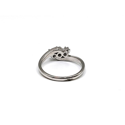 344 - An 18ct white gold diamond trilogy twist ring. Round brilliant cut diamonds 0.25ct. 3.8gms size N 1/... 