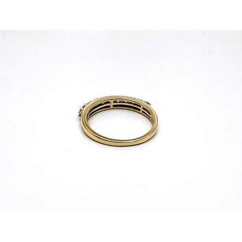 345 - A 9ct yellow gold half eternity ring set with graduated round cut and round brilliant cut diamonds w... 