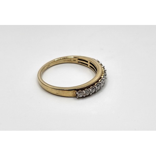 345 - A 9ct yellow gold half eternity ring set with graduated round cut and round brilliant cut diamonds w... 