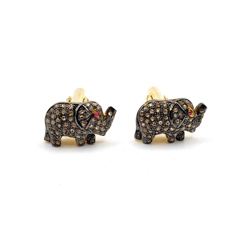 350 - A pair of silver gilt diamond set elephant cufflinks with ruby eye, boxed. Diamonds 0.70ct. approx. ... 