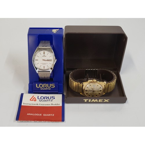 377 - A Lorus water resistant quartz day/date on a stainless steel articulated bracelet. Also including a ... 