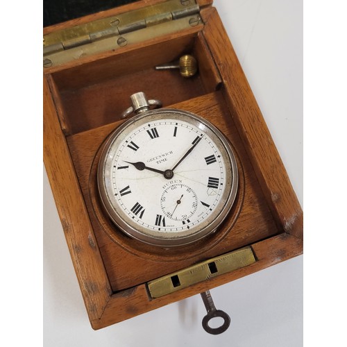 381 - A silver Buren pocket watch, 6cm, presented in a lockable wooden case. Lacking glass on face.