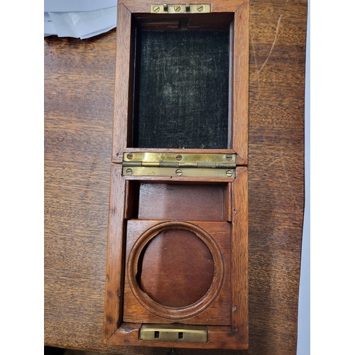 381 - A silver Buren pocket watch, 6cm, presented in a lockable wooden case. Lacking glass on face.