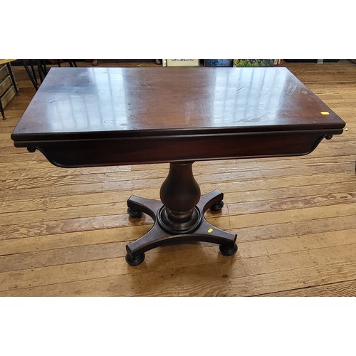 4 - A mahogany card table with swivel top to reveal compartment beneath. 70cm x 91cm x 91cm.