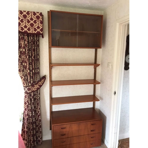 16 - A mid century Ladderax-style wall unit. Approx dimensions when assembled. 200cm x 160cm x 23-39cm.