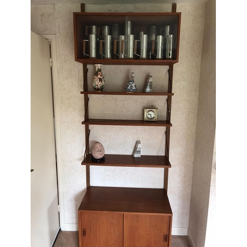 16 - A mid century Ladderax-style wall unit. Approx dimensions when assembled. 200cm x 160cm x 23-39cm.