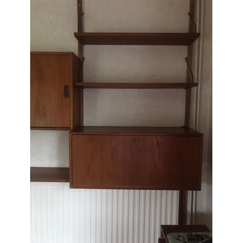 16 - A mid century Ladderax-style wall unit. Approx dimensions when assembled. 200cm x 160cm x 23-39cm.