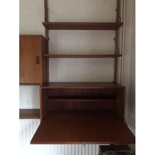 16 - A mid century Ladderax-style wall unit. Approx dimensions when assembled. 200cm x 160cm x 23-39cm.