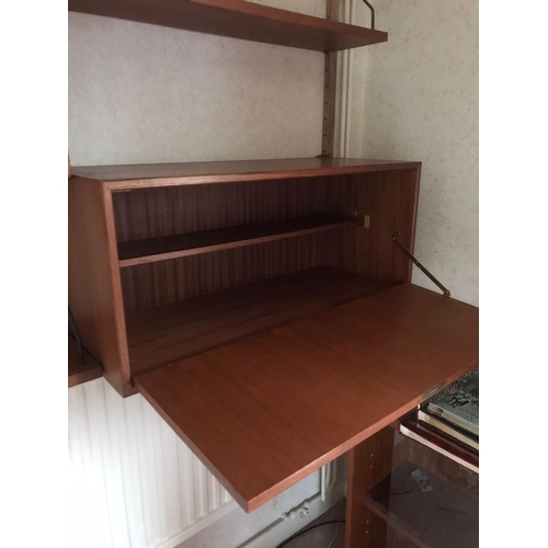 16 - A mid century Ladderax-style wall unit. Approx dimensions when assembled. 200cm x 160cm x 23-39cm.