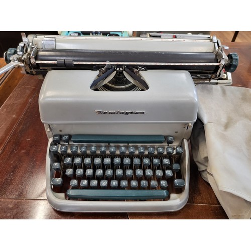 107 - Three vintage typewriters: a Smith Corona Corsair circa 1970 in original case, a Remington Rand in o... 