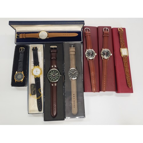 407 - A collection of eight unworn, boxed fashion watches.