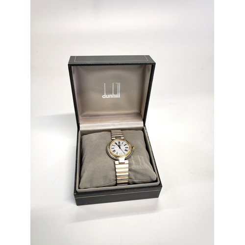 410 - An Alfred Dunhill Date/Just Quartz wristwatch in original  presentation box. Personally inscribed on... 