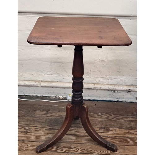 32 - A square Victorian mahogany side tilt top table on a turned support and tripod base. Height 75cm.