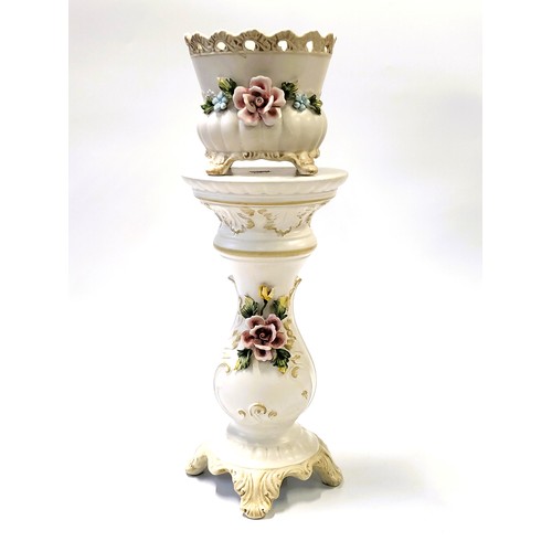 206 - An Italian bisque jardiniere on pedestal stand with applied floral decoration, 65.5cm overall height... 