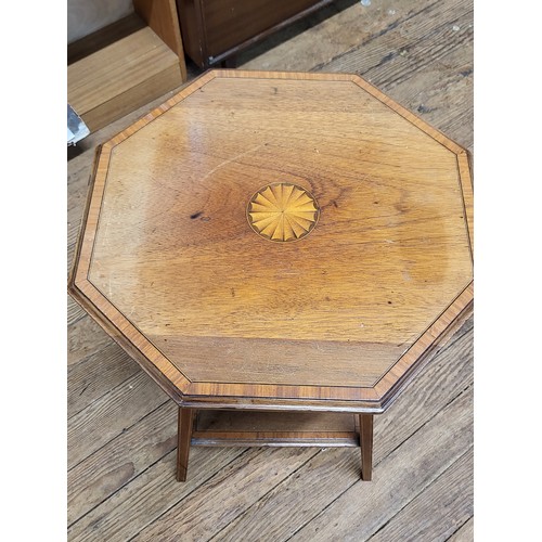 36 - A mahogany Edwardian octagonal table. 69cm x 44cm.