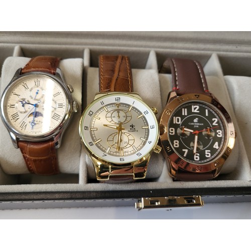 387 - A collection of four watches, including a Rotary Moonphase, a Guess gold plated date/just and two ot... 