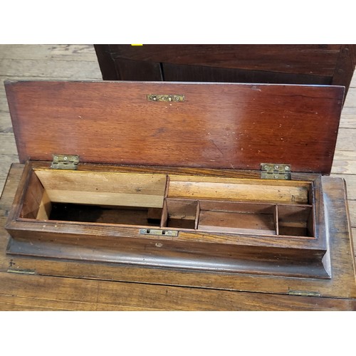 37 - A mahogany Davenport desk with a pencil/ pen section under a marquetry feature,  leather insert on t... 