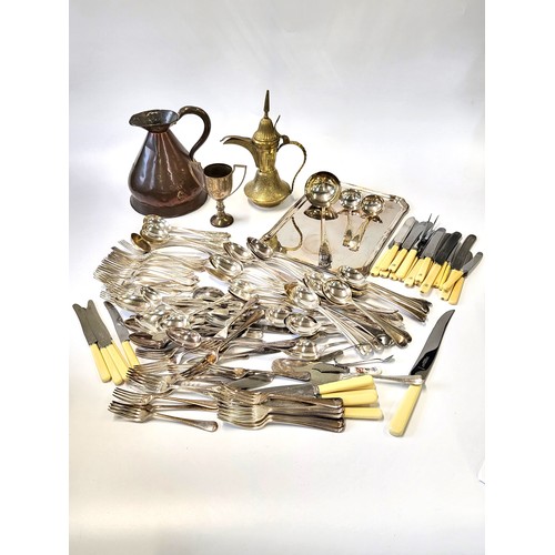 176 - A collection of metalware including a copper jug, silver plate and cutlery.