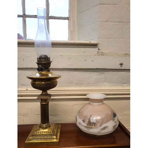 177 - A brass oil lamp with a hand painted shade 68cm