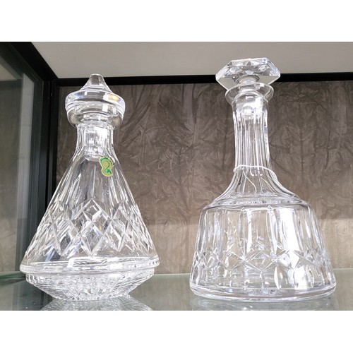 220 - A fine Waterford Crystal decanter together with another quality cut glass decanter. (2)