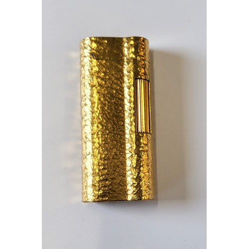 172 - A Dunhill gold plated 'bark effect' lighter.