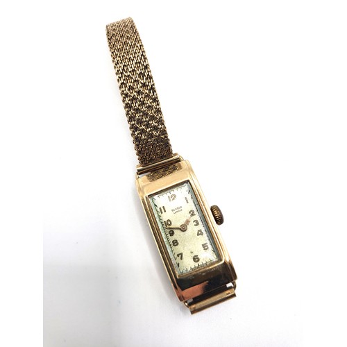 278 - A 9ct yellow gold Benson London ladies watch. Oblong face. 17gms all in.