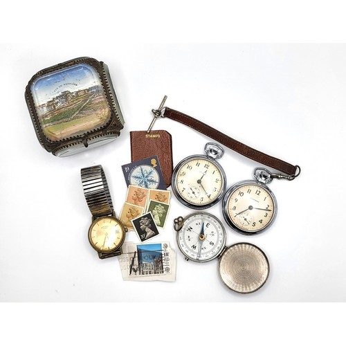 279 - Two pocket watches, a wristwatch, a compass, a miniature leather stamp wallet containing seven UK st... 