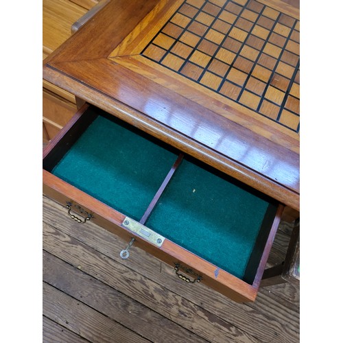 6 - A beech chessboard table with a lockable drawer and key. (65cm x 65cm x 77cm)