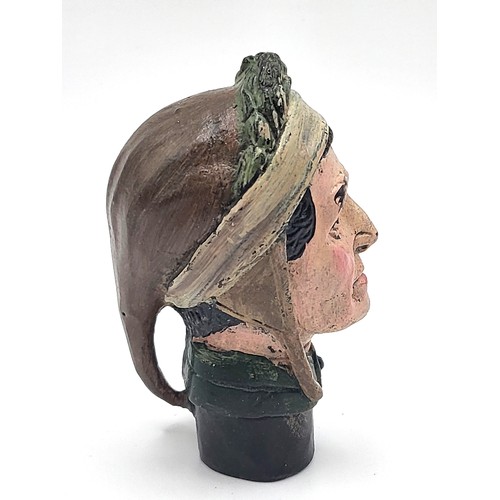 77 - A cold painted bronze walking cane handle in the form of a medieval serf's head. 146gms 8cm