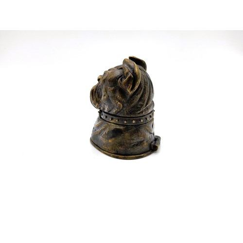 78 - A brass cased vesta in the form of a bulldog with glass eyes. 84gms 5cm.