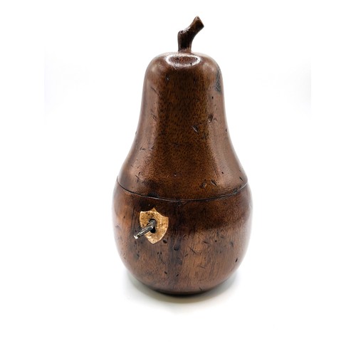 79 - A Georgian style fruitwood pear shaped tea caddy with key. 294gms. 19cm.